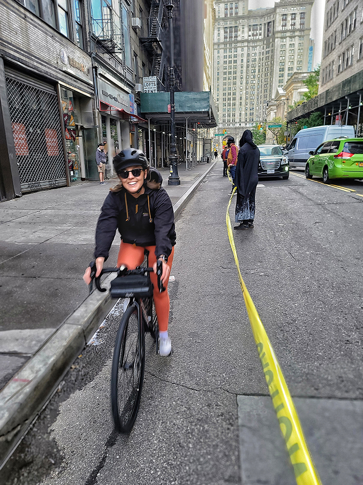 Happy cyclist after riding through our human-protected bike lane